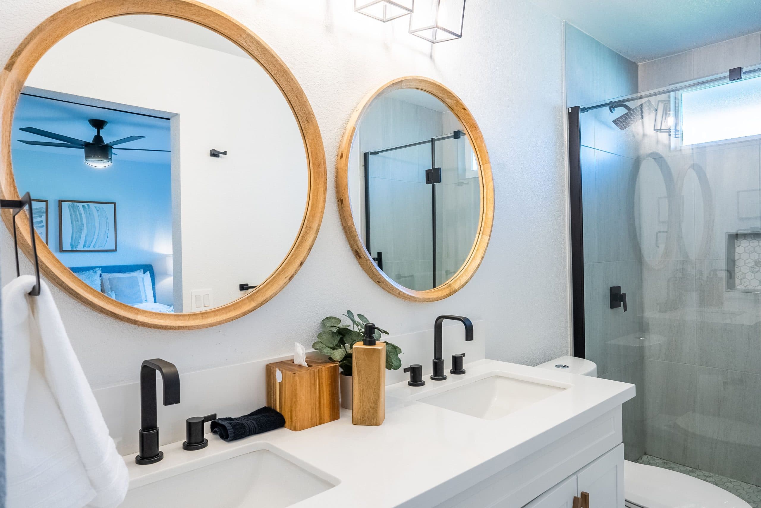Interior of a modern bathroom interior with two round mirrors